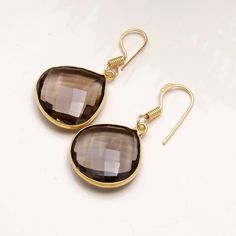 Natural Smoky quartz Gold Earrings, faceted Gemstone, 925 Sterling Silver Earrings, Gold Plated  Handmade Earrings, Dangle Earring Gift Her~ Why To Wear   Smoky quartz As mentioned above, smoky quartz is an incredible stone for grounding. In addition to the many healing properties of the quartz family, smoky quartz is known to dispel negative energy, detoxify the body and energy field from lower vibrations, protect the body from radiation and heal digestion issues.  It can assist us in relieving Smoky Quartz Earrings, Earring Gift, Energy Field, Lovely Earrings, Quartz Earrings, Faceted Gemstones, 925 Sterling Silver Earrings, Earrings Dangle, Smoky Quartz