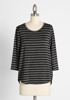 Comfortable enough to slip on for running errands, and polished enough for the office, this ¾ sleeve black and grey striped tee from the ModCloth namesake label, has it all going on ! The striped fabric features metallic silver threading woven throughout, while the back of this beautiful top is contrasted by a solid black panel of flowy recycled chiffon. The hi-lo hemline makes this top perfect for layering over your favorite leggings, or for a more professional vibe, pair with skinny pants and Vintage Style Swimwear, Casual Dresses Plus Size, Sparkly Top, Midi Dress Plus Size, Tunic Hoodie, Casual Rompers, Plus Size Outerwear, Midi Dress Casual, Plus Size Sweaters