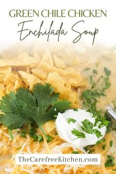 green chile chicken enchilada soup in a bowl with sour cream and cilantro