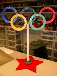 the olympic rings are lit up on top of a table