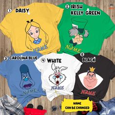 four different shirts with names on them and some cartoon characters in the same shirt colors