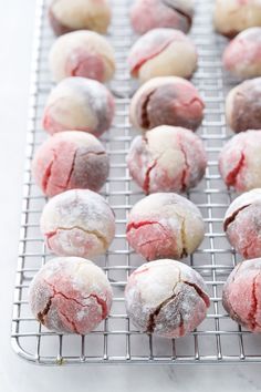 powdered sugar covered pastries cooling on a wire rack, ready to be baked