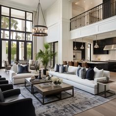 a living room filled with furniture and lots of windows