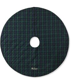 a green and black plaid pattern with the word miller on it's center circle