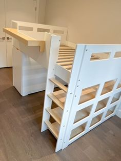 bunk bed with built in desk underneath it