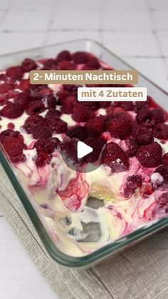 a dessert dish with raspberries and cream in it