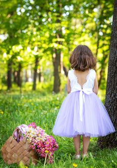 Our exquisite flower girl dress features delicate pure white bodice lace, showcasing a V-shaped back and a puffy tulle skirt, imparting the perfect boho look for your little princess. The soft lace bodice adds a touch of glamour, accentuating angelic innocence, while the flowing tulle skirt creates a dreamy silhouette that will mesmerize all. With a convenient zipper and cotton lining, it offers practicality alongside its charm. 🌷 Versatile and charming, this dress is the perfect choice for var Sleeveless Bridesmaid Princess Dress With Lace Trim, Princess Bridesmaid Dress With Lace Trim, Bridesmaid Princess Dress With Lace Trim, Lace Trim Princess Dress For Dress-up, Lace Dress With Lace Back For Dress-up Occasions, White Lace Bodice Tutu Dress For Bridesmaid, White Tulle Tutu Dress For Garden Party, White Princess Dress With Lace Patchwork For Dress-up, Tulle Dress With Lace Back For First Communion