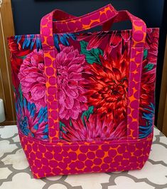 "Pink Tote Bag Delightful & bright pink & orange tote bag.  This bag is 12\" widex15\" high & 5\" deep. It has sturdy handles to carry books, towels, overnight clothes & more. An inside pocket to keep your  phone & small items separate." Quilt Bag Patterns, Zippered Tote Bag Pattern, Sewing Tote Bags, Purses To Sew, Quilted Bag Patterns, Orange Tote Bags, Zippered Tote Bag, Bags Fabric, Pretty Purses