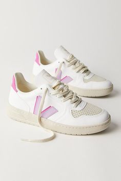 Made from sustainable materials, these retro-style leather sneakers feature colorful details and a logo on the side. * Padded collar and footbed * Low-top style * Textured rubber sole **VEJA** VEJA sneakers are made using fair trade principles and are composed of raw and wild materials sourced from organic farming and ecological agriculture, without chemicals or pollutants. They work directly with the Seringueiro community in the Amazon Rainforest to harvest wild rubber, which is used in the sole of every VEJA sneaker. Each pair of VEJA sneakers is produced in the same factory in the state of Rio Grande do Sul in southern Brazil. | Veja V-10 Sneakers at Free People in Purple, Size: EU 39 Organization Shoes, Dressing Shoes, Shoes Dressing, Shoe Outfits, Storage Shoes, Shoe Organization, Shoes Dresses, Veja V 10, Shoes Storage