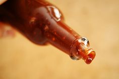 a close up of a brown bottle with water droplets on it