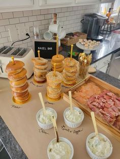 an assortment of pastries and sandwiches on a counter