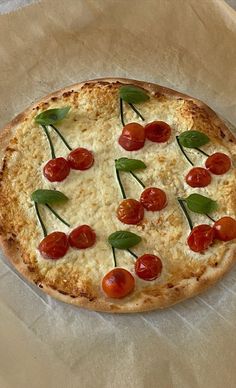 a pizza sitting on top of a piece of wax paper