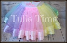 Rainbow ribbon trim Tutu Make your little girl feel like a princess at her next birthday party or event!!This listing is for the ribbon trimmed tutu only!!This is made with satin ribbon.pink, yellow, mint, baby blue & lavenderSee shop announcements for turn around times- which is usually 2+weekshttps://www.etsy.com/shop/Tulletime/policy?ref=shopinfo_policies_leftnavNeed it sooner? Add rush order and it will be moved to the top of my list-https://www.etsy.com/listing/124798027/add-rush-to-any-of- Fun Tulle Tutu Dress For Birthdays, Whimsical Birthday Tutu Dress With Tulle Skirt, Whimsical Tutu Dress With Tulle Skirt For Birthday, Rainbow Tutu Dress For Birthday In Spring, Princess Tutu Dress For First Birthday Easter, Princess Style Tutu Dress For First Birthday Easter, Rainbow Tutu Dress For Birthday, Cute Rainbow Tutu Dress For Birthday, Easter Unicorn