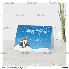 a christmas card with an owl wearing a santa hat on it's head in the snow