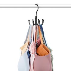 a bunch of clothes hanging on a rack