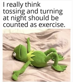 a green stuffed animal laying on top of a bed next to a caption that reads, i'm not turning my clock back on sunday the last thing we need is an extra hour of 2020