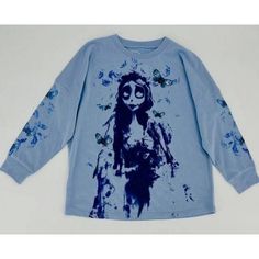 a long sleeved shirt with an image of a woman on the front and blue paint splatters all over it