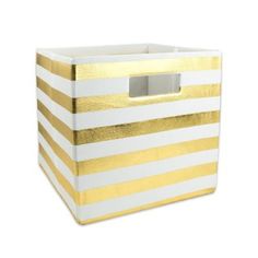 a white and gold striped storage box