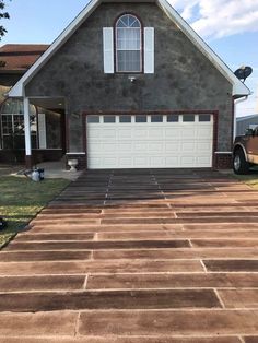 a house with a large driveway in front of it