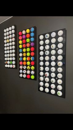 there are three different types of buttons hanging on the wall in front of each other