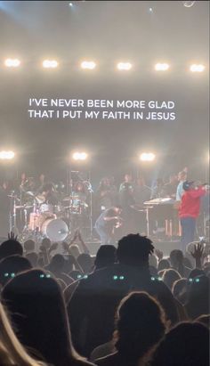 a group of people standing on top of a stage next to each other in front of a crowd