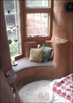 a bedroom with a round bed and windows