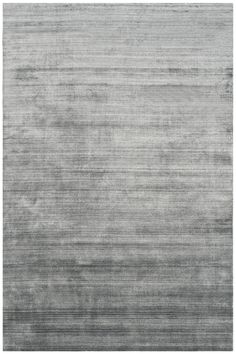 a gray rug with horizontal stripes on it