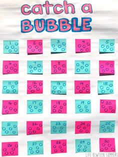 a bulletin board with pink and blue paper on it that says, catch a bubble