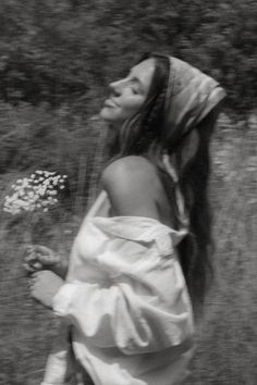 black and white photograph of woman with flowers