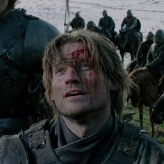 game of thrones characters with blood all over their face and body, standing next to each other