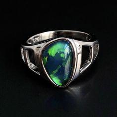 "Natural Australian black Opal triplet Sterling Silver Ring, one-off piece of natural opal set in sterling silver in a modern design.  Please note: All my Australian black Opals are one-off pieces so some rings will need to be resized to your size once the order is placed, please allow 4-5 working days for me to change the size for you.  Made of solid British Sterling Silver with rhodium plating.  Rhodium-plated silver is fine sterling silver that is polished and dipped in rhodium. It has a brig Classic Opal Jewelry With Polished Finish, Silver Opal Ring With Polished Finish, Black Oval Opal Jewelry, Oval Black Opal Jewelry, Formal Sterling Silver Opal Birthstone Ring, Formal Silver Opal Birthstone Ring, Silver Opal Cabochon Ring In Fine Jewelry Style, Natural Opal Ring, Australian Black Opal