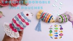 crocheted fish pooches are being held up by someone's hand