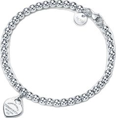 Classic White Gold Jewelry With Logo Charm, Classic Bracelets With Logo Charm As A Gift, Elegant Sterling Silver Heart-shaped Charm Bracelet, Elegant Bracelets With Logo Charm As Gift, Elegant Bracelets With Logo Charm For Gift, Elegant Sterling Silver Beaded Bracelet With Heart Charm, Engraved Classic Charm Bracelet, Elegant Everyday Jewelry With Logo Charm, Elegant Silver Bracelet With Logo Charm