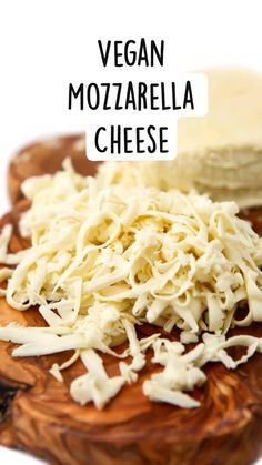 vegan mozzarella cheese on a wooden platter with text overlay that reads, vegan mozzarella cheese