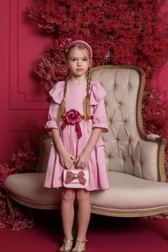 This dress is designed for girls and has a soft, baby-pink color with pretty floral appliques. The dress is also adorned with ruffles, adding a cute and feminine touch. #girls #dress Pink Flower Dress, Dress Outer, Baby Pink Colour, Girls Pink Dress, Designer Kids, Ruffled Dress, Designer Kids Clothes, Velvet Trim, Flower Dress