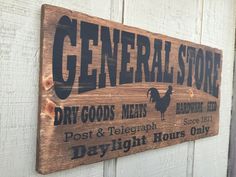 a sign on the side of a building that says general store dry goods mens and telegraph days daylight hours only