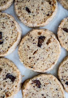 several cookies with raisins are arranged on a table