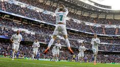 the soccer players are jumping up in the air to celebrate their team's victory