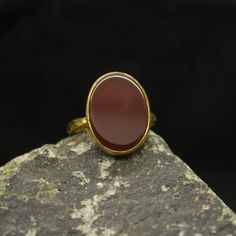 Red Agate Silver Ring | Minimalist  Carnelian Ring  | 925 Sterling Silver 24K Gold Plated | Roman Art Jewelry | Handmade  Gift  Handcrafted hammered  Silver RingOur shop offer free ring sizing and color options.(Oxidized(Black),Gold Plated)Metal : 925 Sterling SilverGemstone : Carnelian Gem Size : 17 X 13 mmBand Size : 2 mmRing Weight : 4.4 gramsRing Size : US 6 (The size you want is made for free).(We used the US standard sizing) **Custom Orders is Made**As pellada family, we will be happy to h Classic Chalcedony Rings As Gift, Yellow Gold Chalcedony Ring Gift, Carnelian Oval Cabochon Ring As Gift, Carnelian Ruby Ring With Oval Cabochon For Gift, Carnelian Oval Cabochon Ring For Gift, Handmade Classic Carnelian Jewelry, Yellow Gold Agate Rings For Gift, Gold Carnelian Gemstone Ring, Gold Rings With Carnelian Gemstone