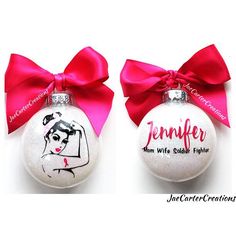 two personalized christmas ornaments with pink bows