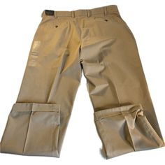 Elevate Your Wardrobe With These Stylish Brooks Brothers Chino Pants In Tan. Designed With The Elliot Fit Advantage And Pleated For Added Volume, These Pants Are Perfect For Any Occasion. The Waist Size Is 40 Inches And The Inseam Measures 32 Inches, Making It An Ideal Fit For Regular-Sized Men. Made From High-Quality Cotton Material And Featuring Stretch Technology, These Pants Are Not Only Comfortable But Also Wrinkle-Free. Perfect For A College, Preppy Or Business-Themed Outfit, These Chinos Beige Flat Front Pants With Pockets, Classic Big And Tall Straight Leg Bottoms, Classic Straight Leg Bottoms For Big And Tall, Beige Flat Front Dress Pants With Pockets, Big And Tall Straight Leg Bottoms With Welt Pockets, Big And Tall Flat Front Workwear Bottoms, Big And Tall Workwear Bottoms With Welt Pockets, Classic Big And Tall Workwear Bottoms, Classic Big And Tall Bottoms For Workwear