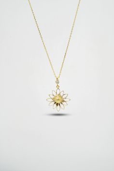 14 K Gold Daisy Necklace This Fine Jewelry Gold Necklace is ideal for the special woman in your life. The beautiful 14 K Gold Daisy Necklace displays a stunning and delicate daisy made of gold. Each petal is intricately crafted to create a gorgeous daisy that is sure to make an extraordinary statement. The gentle curves of the daisy will perfectly frame her face, and its shimmering gold is sure to catch everyone's eye. This stunning piece of fine jewelry is both bold and delicate, perfect for an 14k Gold Flower Pendant Necklace As Gift For Mom, 14k Gold Flower Pendant Necklace For Mom, Yellow Gold Flower Pendant Necklace For Mom, Handmade Yellow Gold Flower-shaped Necklace, Handmade Yellow Gold Flower Shaped Necklace, Handmade Yellow Gold Flower Necklace, White Fine Jewelry Necklaces With Flower Charm, White Flower Charm Necklace Fine Jewelry, Fine Jewelry White Flower Necklace