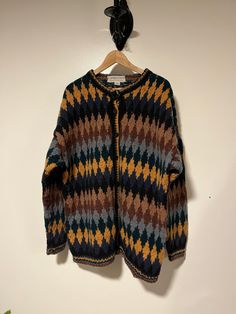 Super fun KUMBESHWAR multicoloured wool sweater /cardigan Hand knitted in Nepal 💯 % wool Size XL see measurements for sizing all measurements are taken while item is laying flat  Neck 9" Pit to pit 25" Length 31" Sleeve from Shoulder seam to cuff 23" Any questions just ask!  Shipping is included in purchase price.  Vintage item, regular wear due to age should be expected.  Any known flaws/marking will be listed. No returns / exchanges but please advise if there is an issue with your item Multicolor Wool Long Sleeve Cardigan, Multicolor Wool Knit Sweater, Multicolor Knitted Wool Sweater, Vintage Multicolor Cardigan For Fall, Retro Wool Cardigan With Fair Isle Pattern, Vintage Multicolor Knit Cardigan, Multicolor Vintage Knit Cardigan, Vintage Multicolor Cardigan For Winter, Multicolor Long Sleeve Outerwear With Fair Isle Pattern