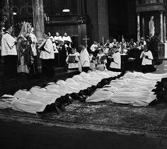 black and white photo of people laying on the ground