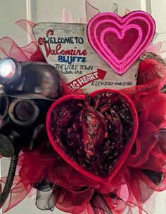 a valentine wreath with gas masks and hearts