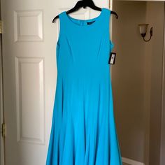 Turquoise. Fitted Waist. Never Worn. Would Be Great For Work Or A Wedding. Elegant Sleeveless Midi Dress In Turquoise, Elegant Turquoise Sleeveless Midi Dress, Elegant Sleeveless Turquoise Midi Dress, Fitted Turquoise Midi Dress For Party, Blue Fit And Flare A-line Maxi Dress, Elegant Sleeveless Turquoise Dress, Blue Fit And Flare Formal Dress, Elegant Turquoise Dress With Fitted Bodice, Fitted Turquoise Maxi Dress For Party