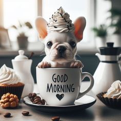 a small dog sitting in a coffee cup with a good morning sign on it