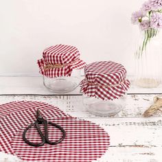 red and white gingham table cloths with scissors on the table next to them