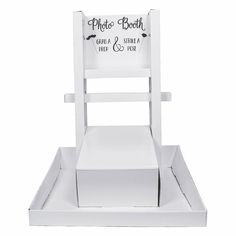 a white wooden chair with writing on it