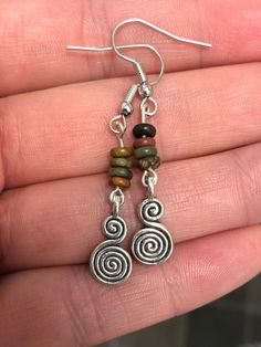 Picasso jasper rondelle gemstone bead earrings with Tibetan silver spiral charms and surgical steel ear hooks Memorial Board, Quirky Accessories, Fall School, Picasso Jasper, Spiral Earrings, Jasper Gemstone, Bead Earrings, David Bowie, Handmade Earrings